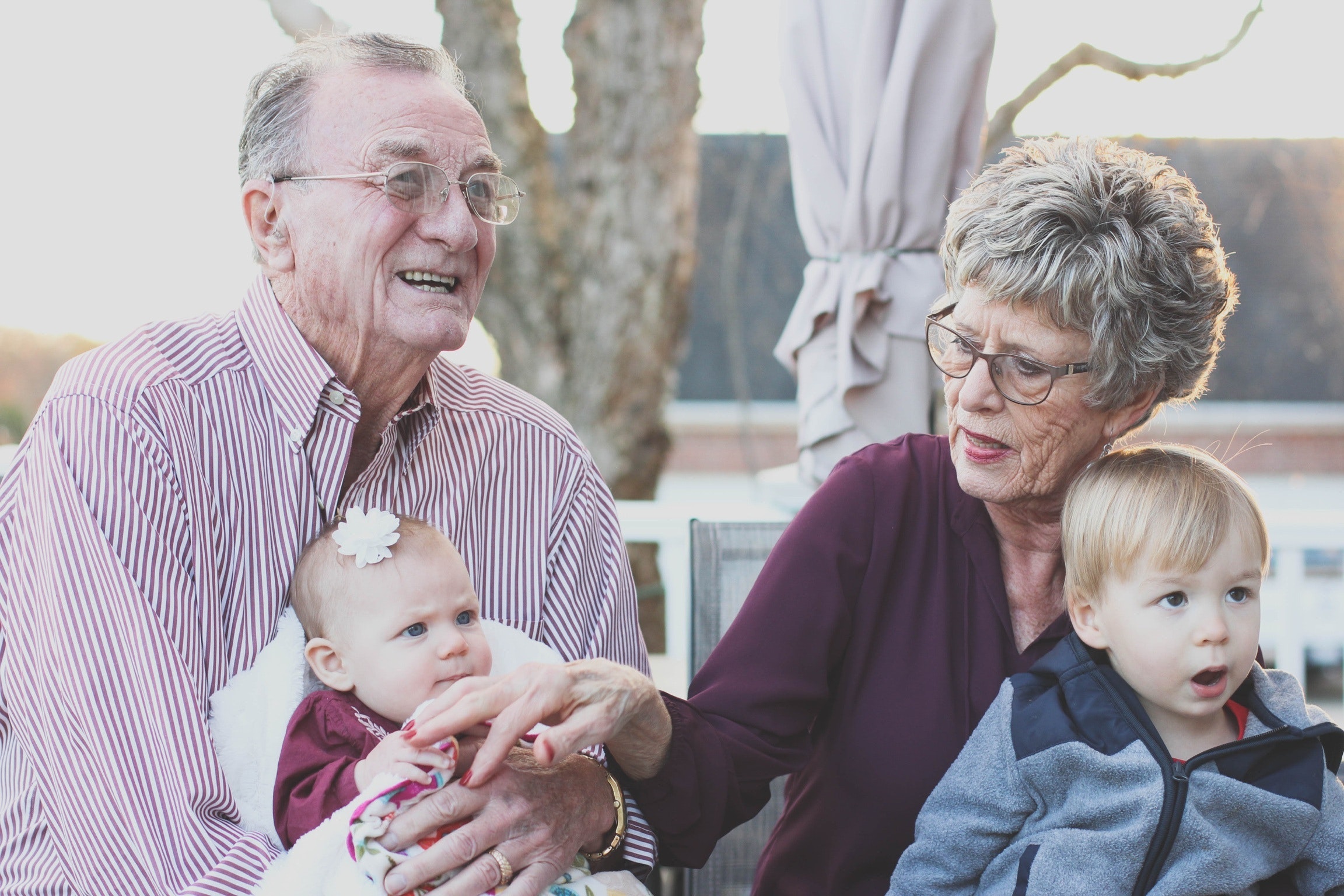 Grandparents-holding-their-grandchildren